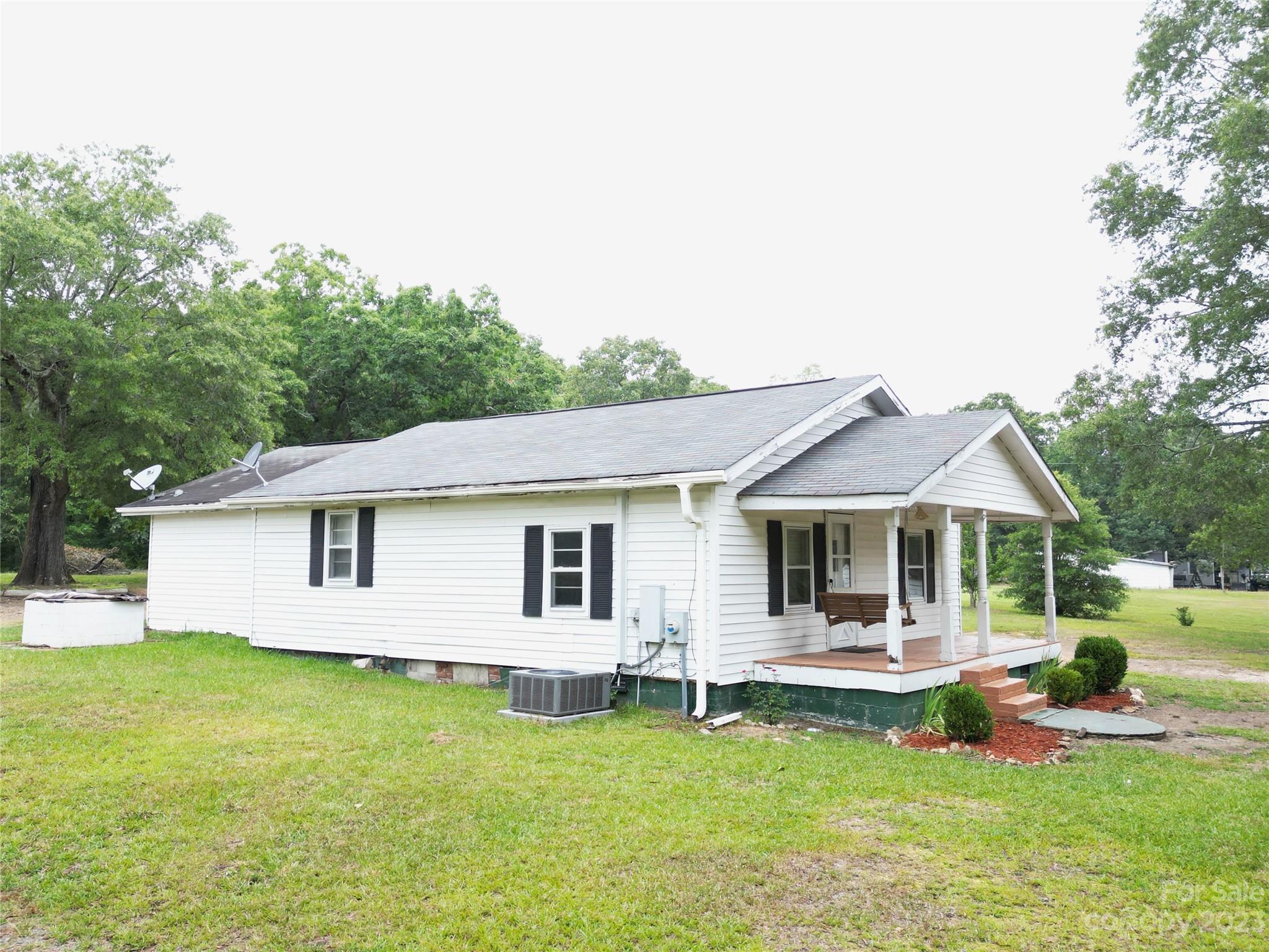 488 Savannah Road Peachland, NC 28133 - Photo 3 of 35 a view of a house with a swimming pool and a yard