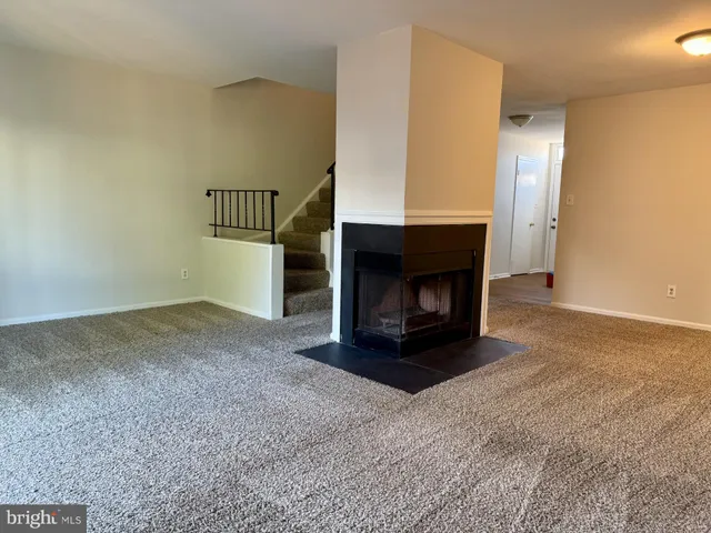 a room with a fireplace and a fireplace