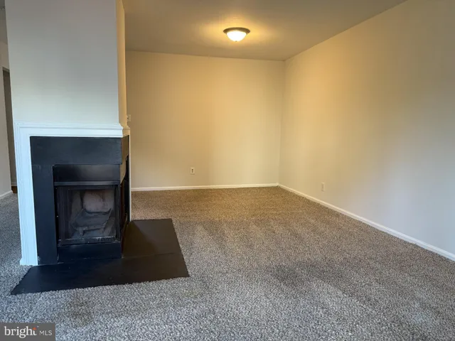 a living room with a fireplace