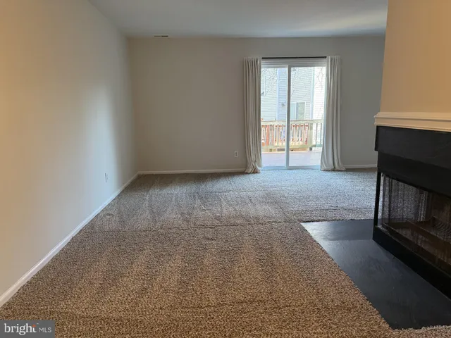 an empty room with fireplace