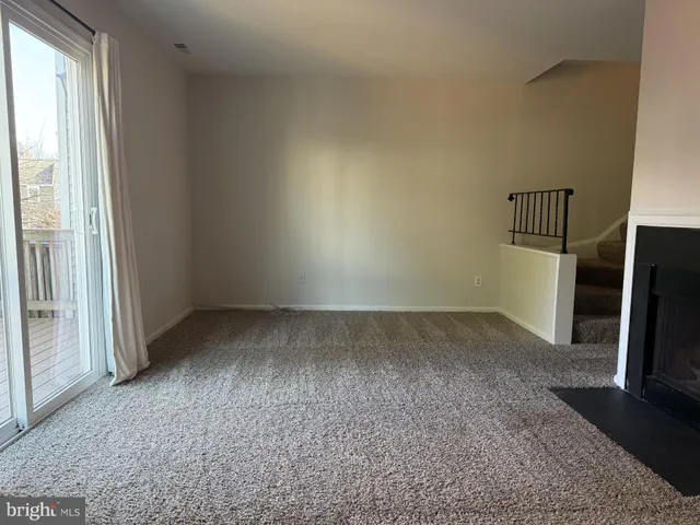 an empty room with a fireplace