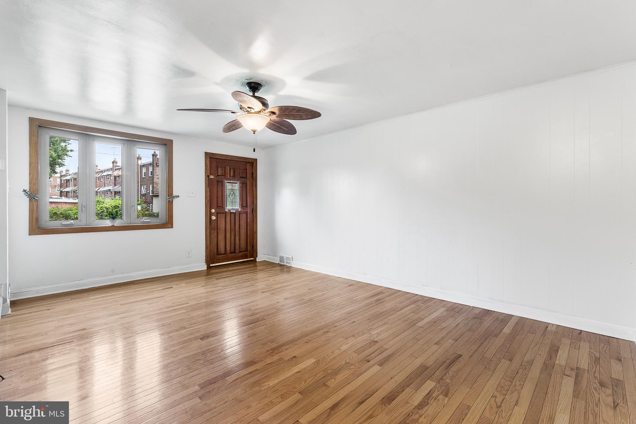 390 Glen Cove Road Collingdale, PA 19023 - Photo 4 of 27 wooden floor in an empty room with a window