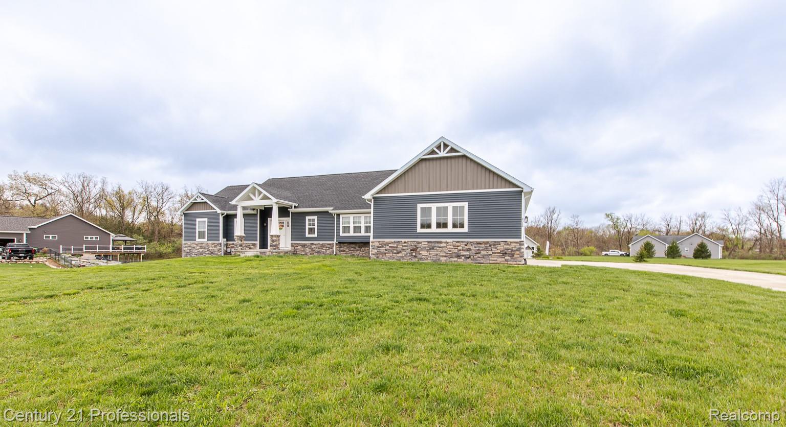 4914 TORATOLA Lane Howell, MI 48843 - Photo 5 of 39 Craftsman inspired home featuring stone siding and a front yard