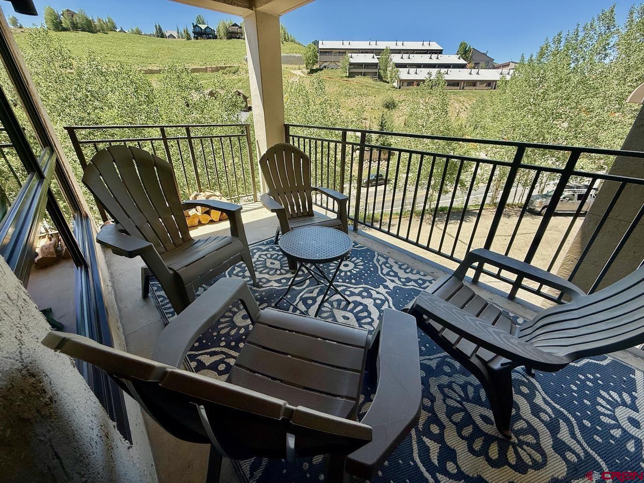 11 Snowmass Road, Unit 337 Crested Butte, CO 81225 - Photo 18 of 35 a view of a balcony with chairs