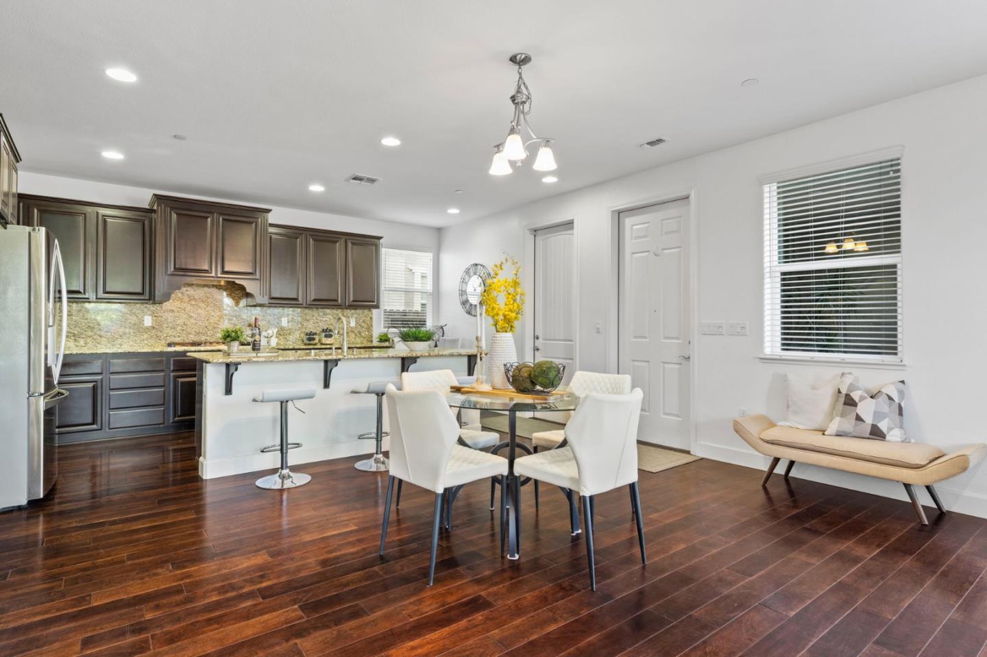 823 Sunrise Drive Gilroy, CA 95020 - Photo 15 of 46 a living room with stainless steel appliances kitchen island granite countertop furniture wooden floor and a kitchen view