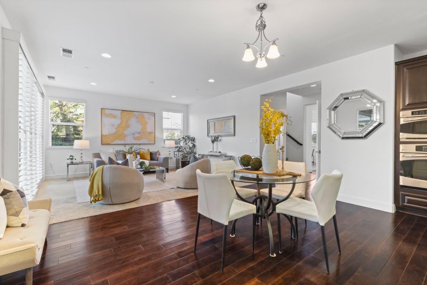 823 Sunrise Drive Gilroy, CA 95020 - Photo 16 of 46 a view of a dining room with furniture window and wooden floor