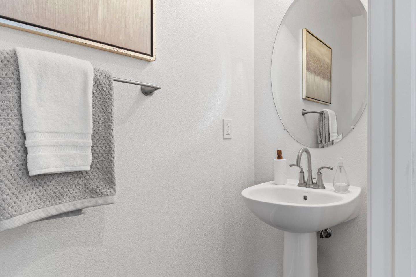 823 Sunrise Drive Gilroy, CA 95020 - Photo 20 of 46 a bathroom with a sink and a mirror