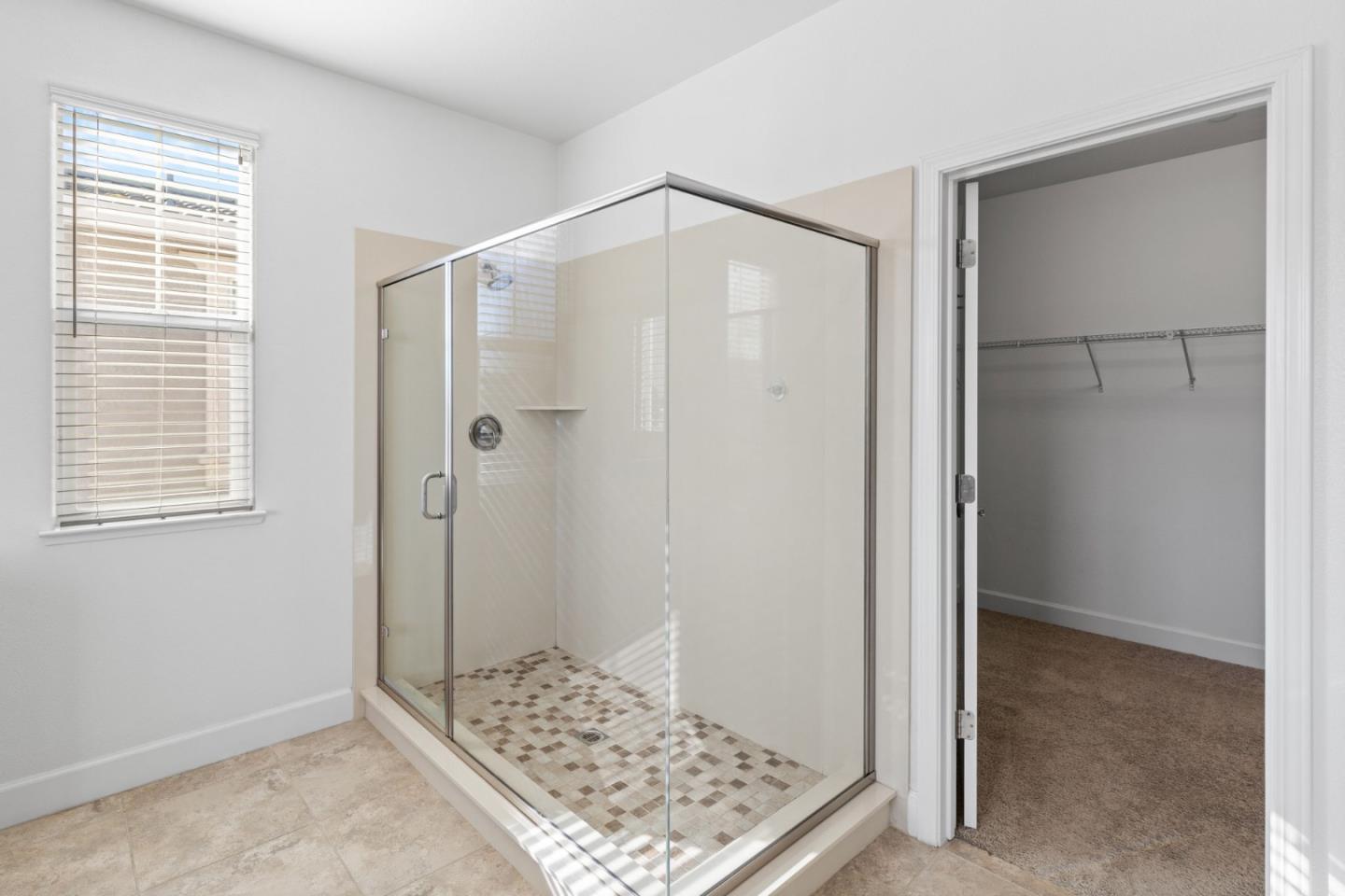 823 Sunrise Drive Gilroy, CA 95020 - Photo 28 of 46 a bathroom with a shower and a wooden floor