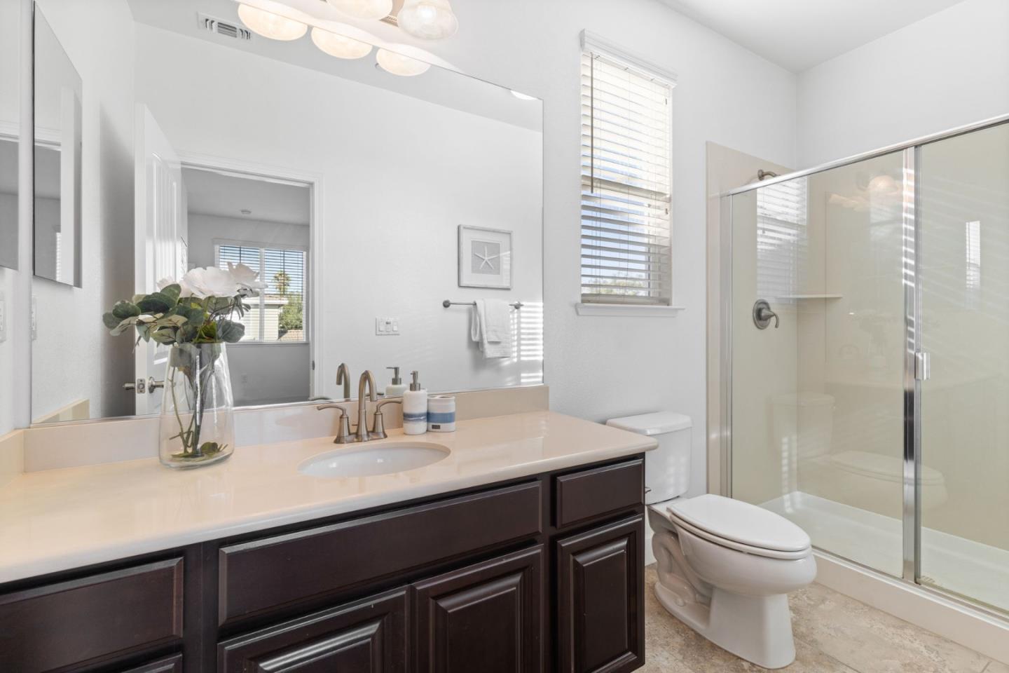 823 Sunrise Drive Gilroy, CA 95020 - Photo 34 of 46 a bathroom with a sink a toilet and shower