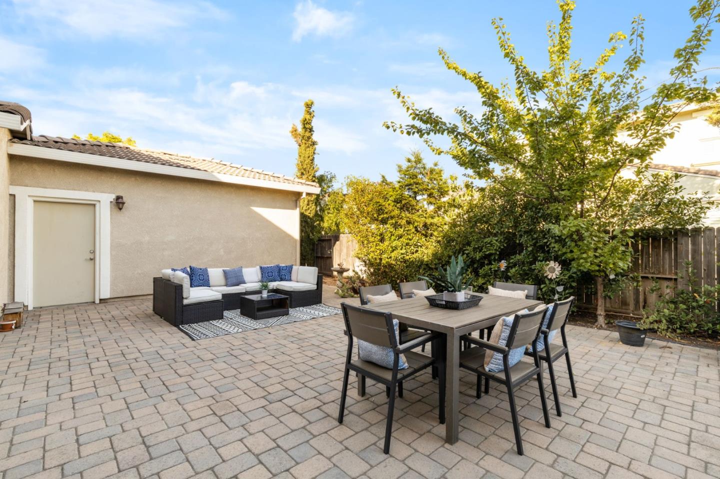823 Sunrise Drive Gilroy, CA 95020 - Photo 36 of 46 a backyard of a house with table and chairs