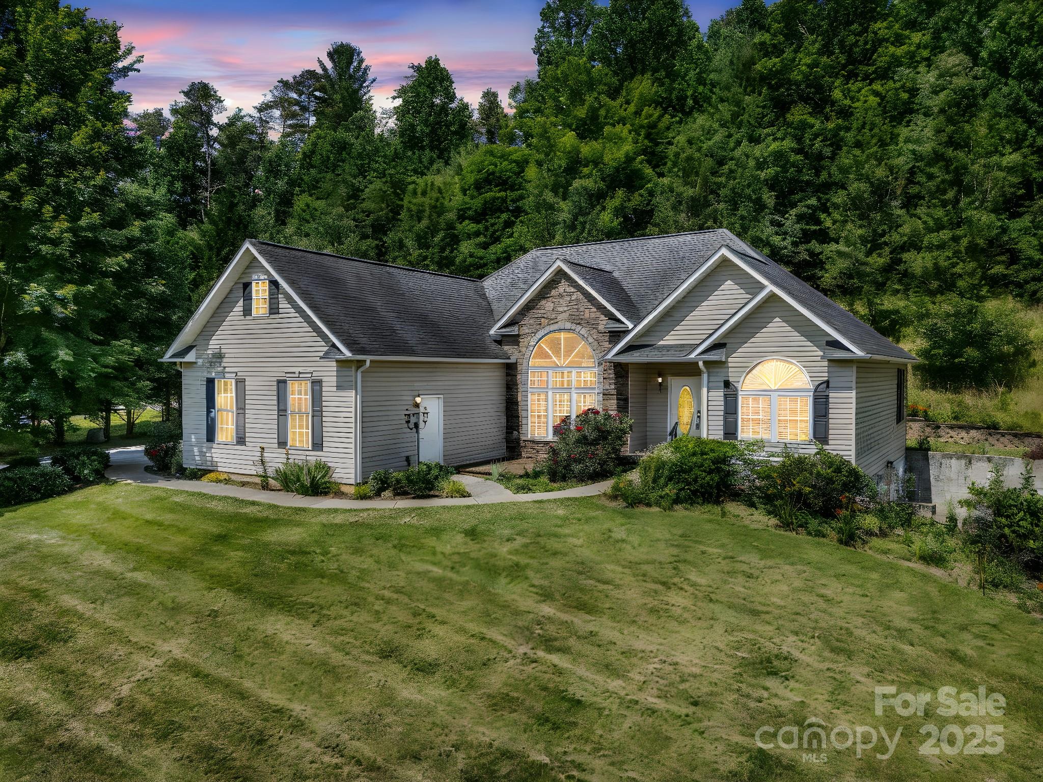 124 Shadow View Drive Leicester, NC 28748 - Photo 11 of 41 a front view of a house with a yard and trees