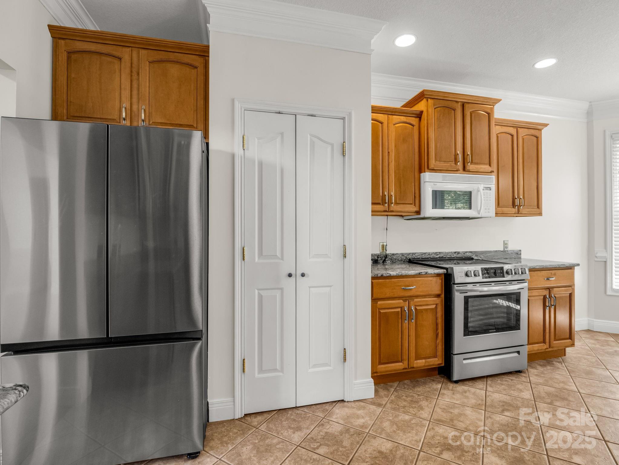 124 Shadow View Drive Leicester, NC 28748 - Photo 17 of 41 a kitchen with stainless steel appliances granite countertop a refrigerator a stove and a sink