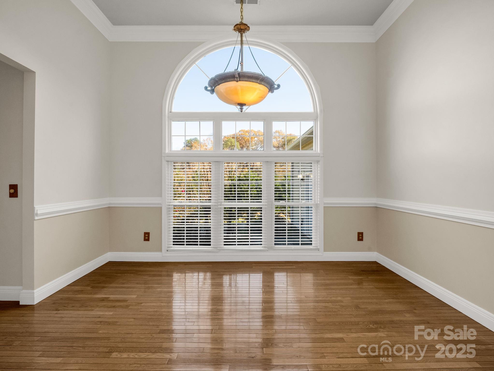 124 Shadow View Drive Leicester, NC 28748 - Photo 18 of 41 a view of an empty room with window and wooden floor