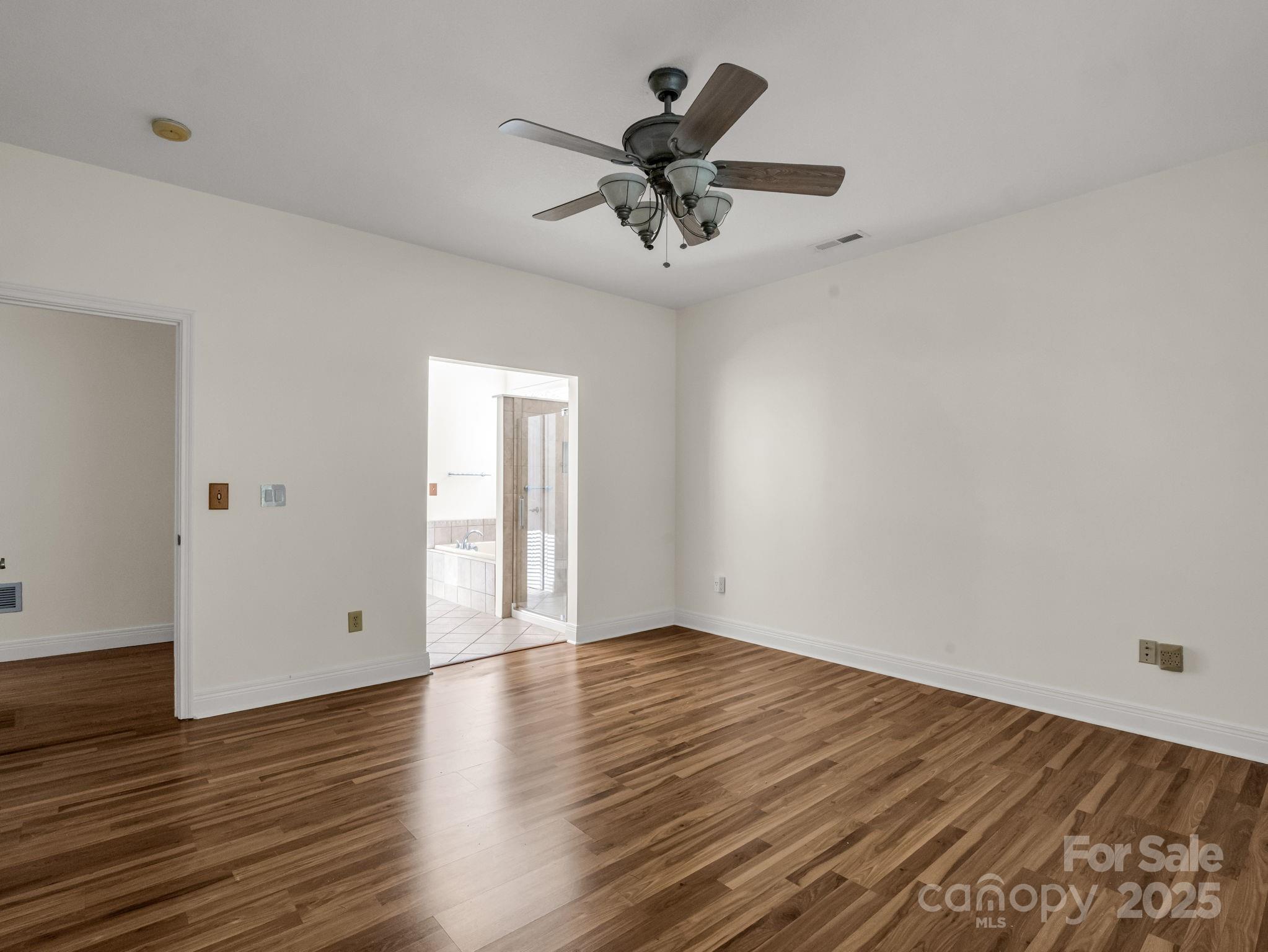 124 Shadow View Drive Leicester, NC 28748 - Photo 21 of 41 wooden floor in an empty room with a window