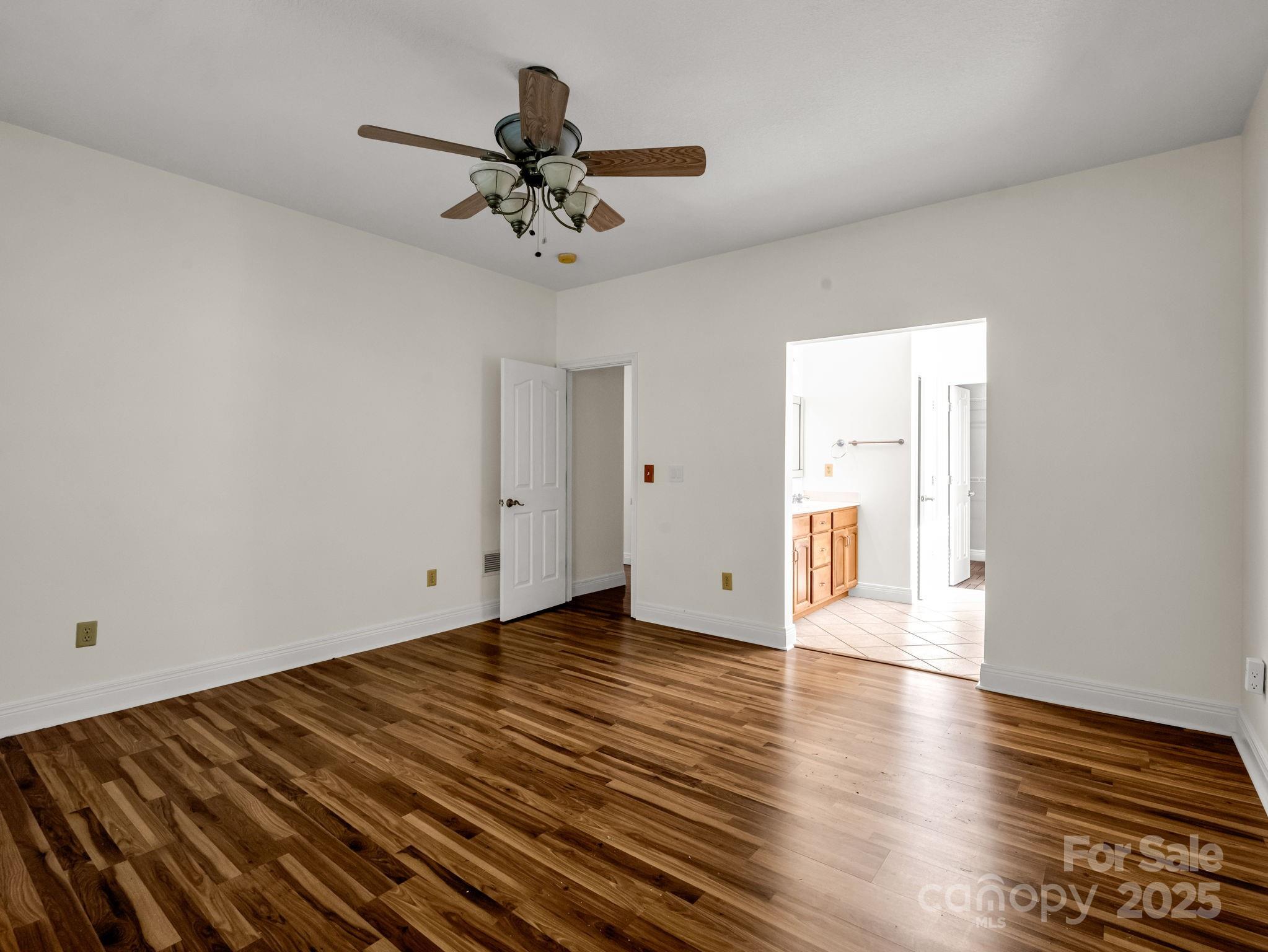 124 Shadow View Drive Leicester, NC 28748 - Photo 22 of 41 a view of an empty room with wooden floor