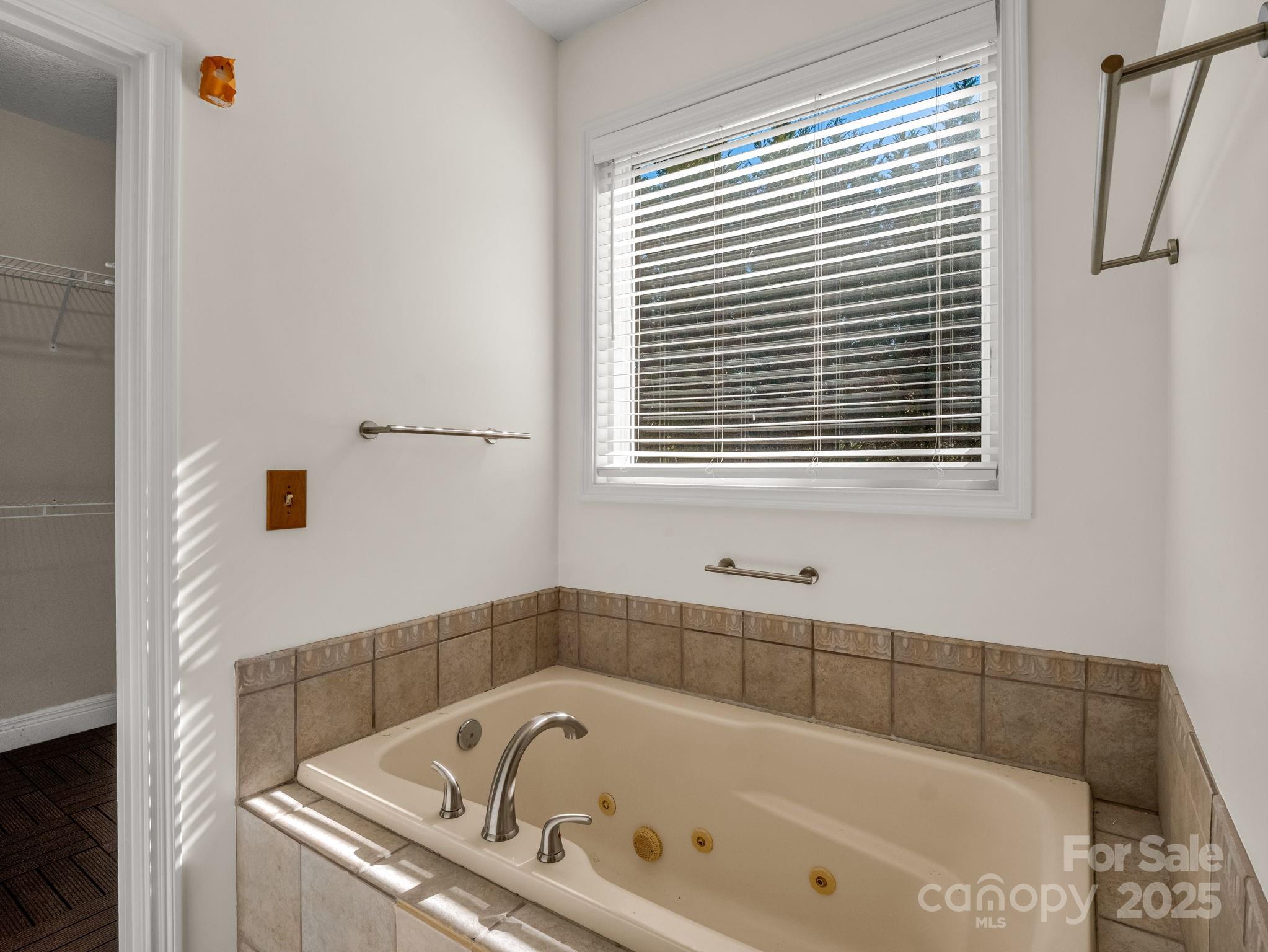 124 Shadow View Drive Leicester, NC 28748 - Photo 25 of 41 a white bath tub sitting next to a window
