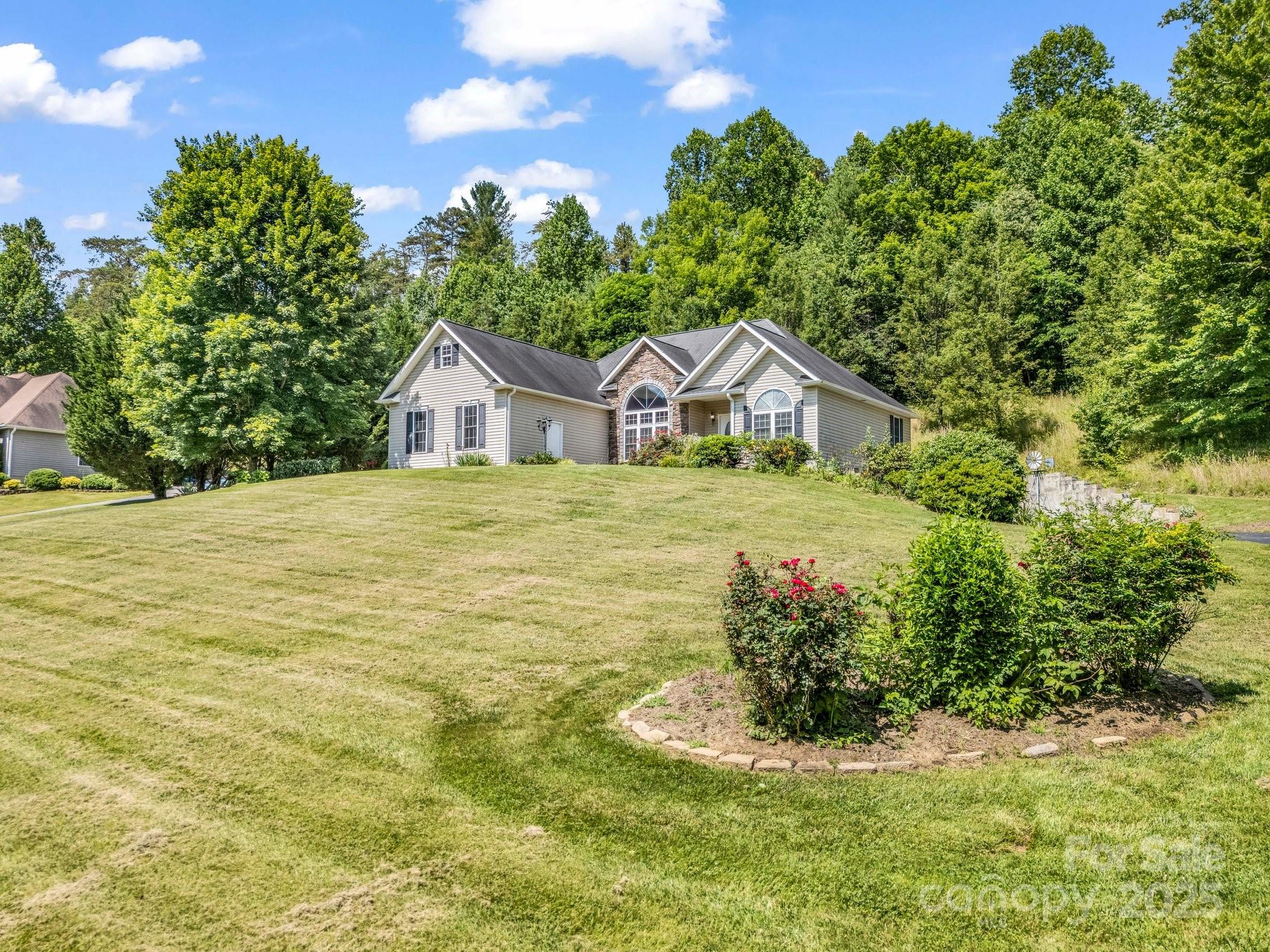 124 Shadow View Drive Leicester, NC 28748 - Photo 34 of 41 a view of a house with a yard and potted plants