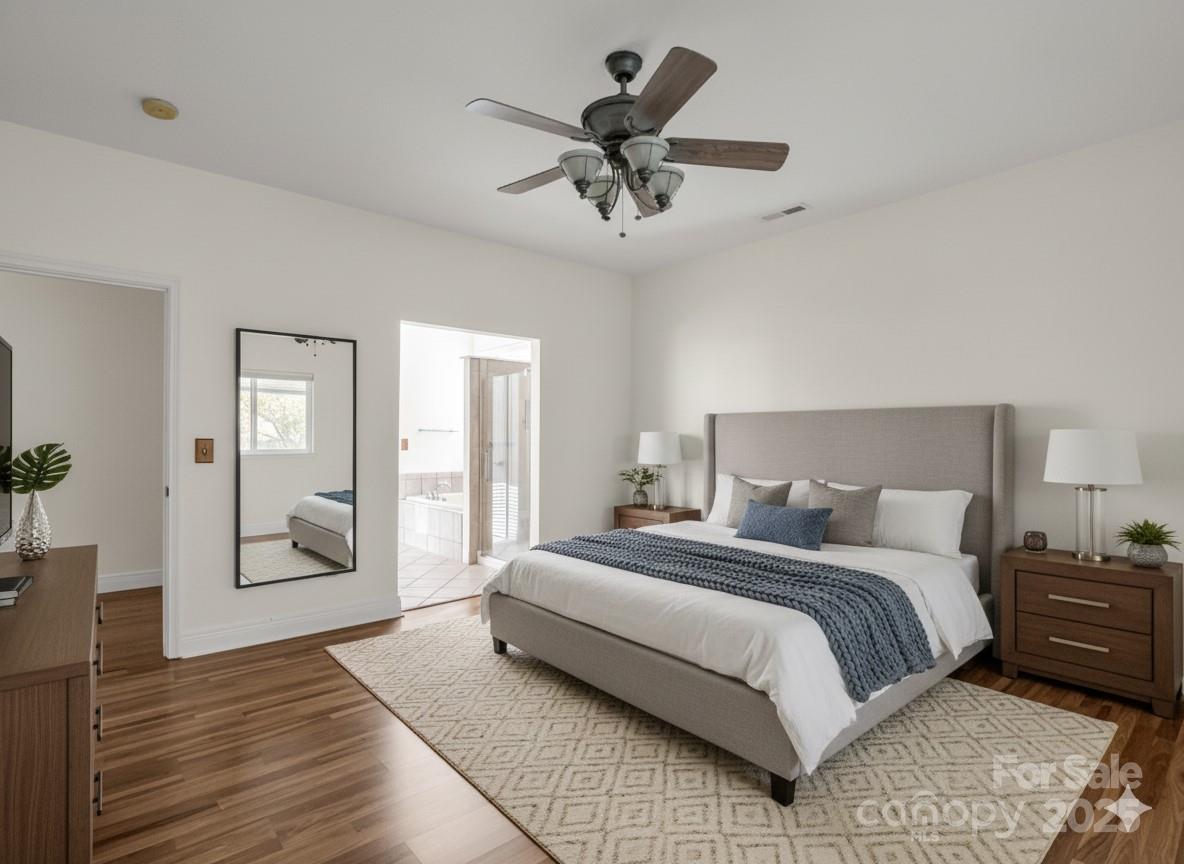 124 Shadow View Drive Leicester, NC 28748 - Photo 5 of 41 a bedroom with a large bed and a chandelier