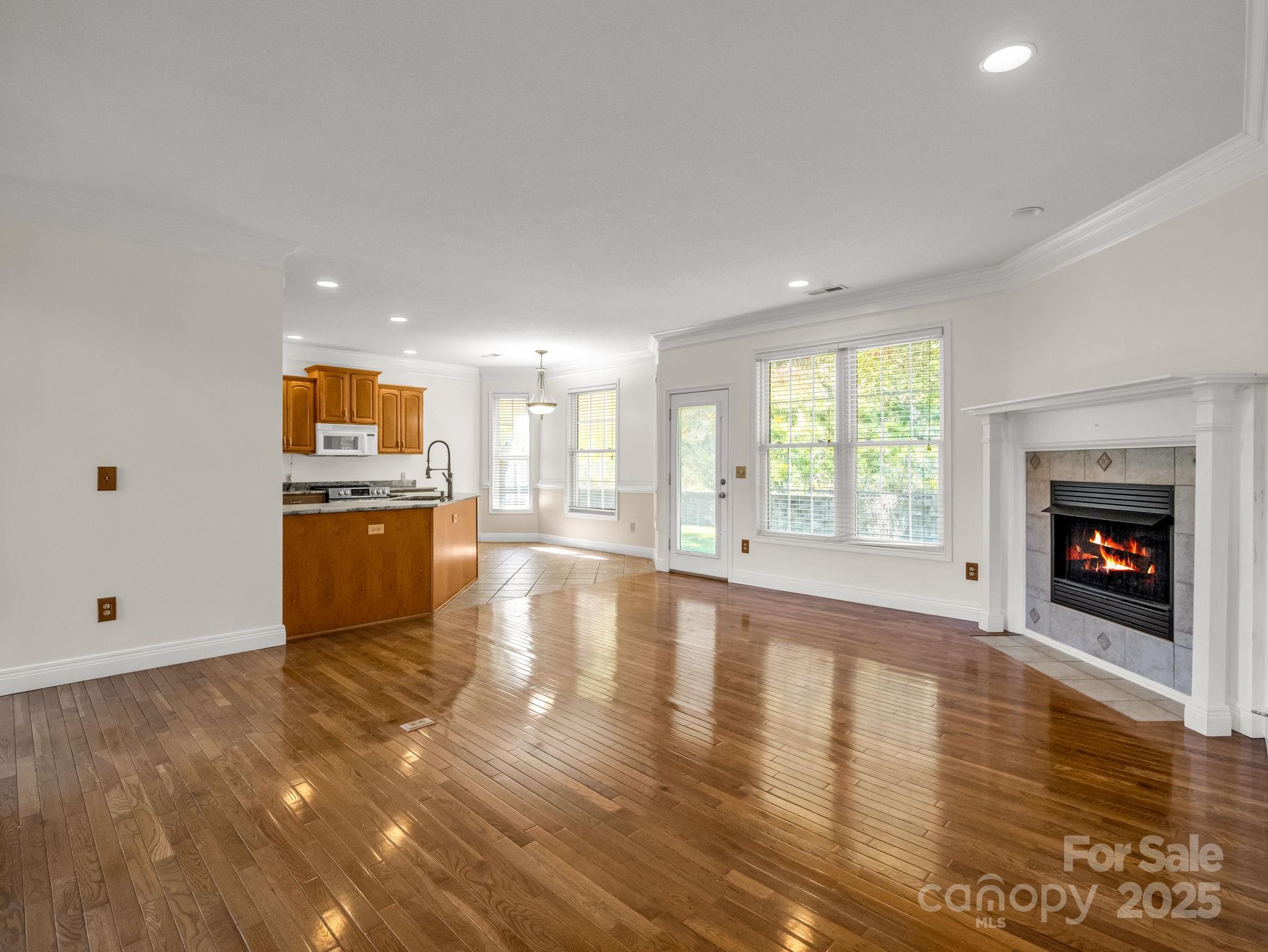 124 Shadow View Drive Leicester, NC 28748 - Photo 9 of 41 a view of kitchen with a sink a fireplace and windows