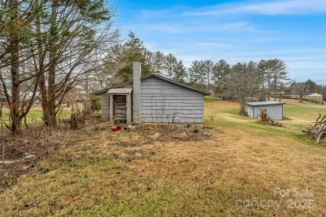 a backyard of a house with lots of green space