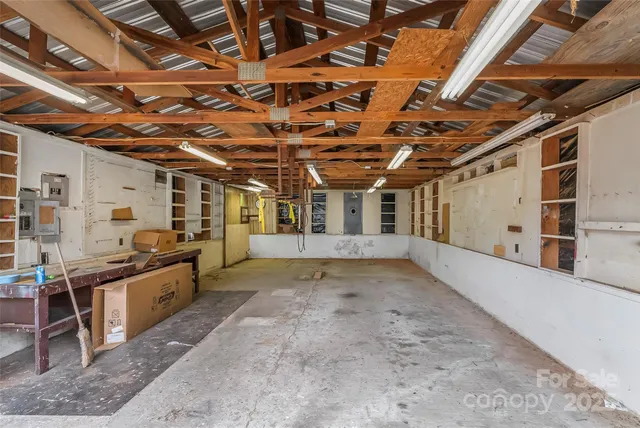 a view of a big room with wooden roof