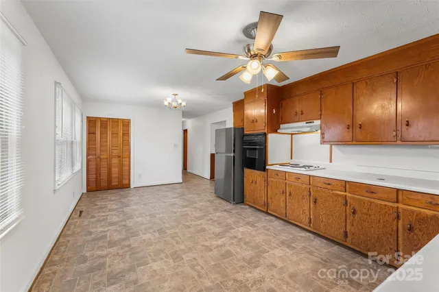 a view of a kitchen with a sink and cabinet area