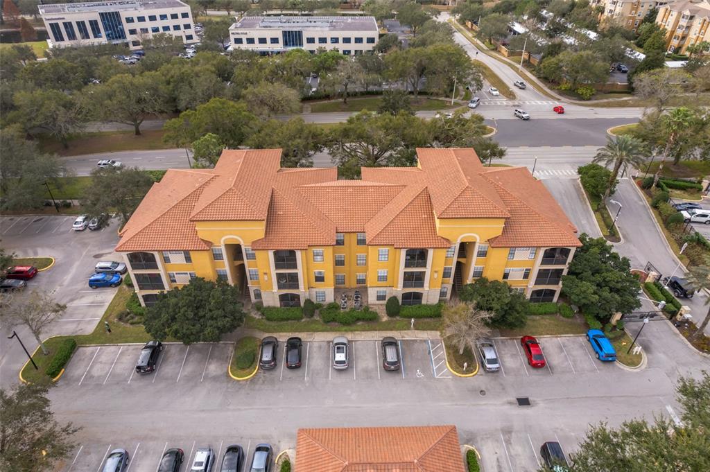an aerial view of a house with garden space and street view