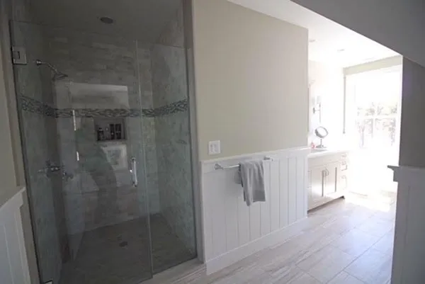a bathroom with a bathtub and shower