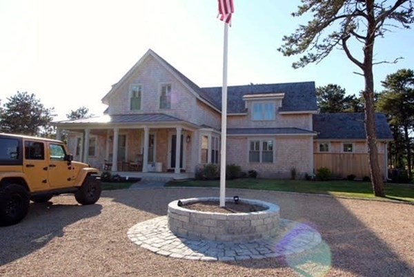 7 Mill Hill Farms Road Edgartown, MA 02539 - Photo 22 of 25 a front view of a house with garden and porch