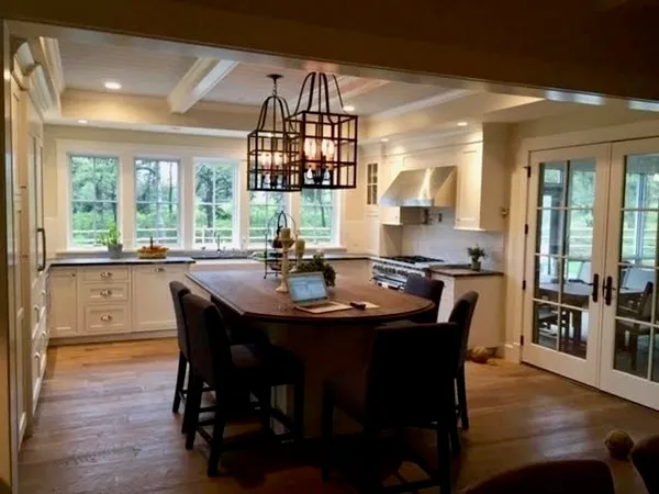 a dining room with furniture a chandelier and wooden floor