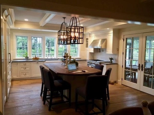 7 Mill Hill Farms Road Edgartown, MA 02539 - Photo 5 of 25 a dining room with furniture a chandelier and wooden floor