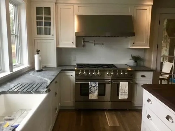 a kitchen with a stove and a microwave