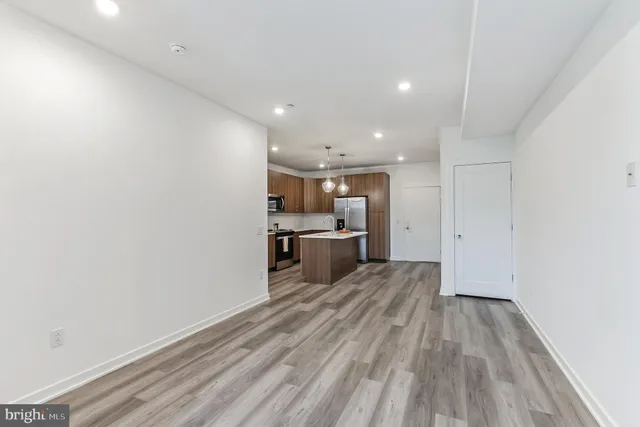 a view of kitchen with wooden floor