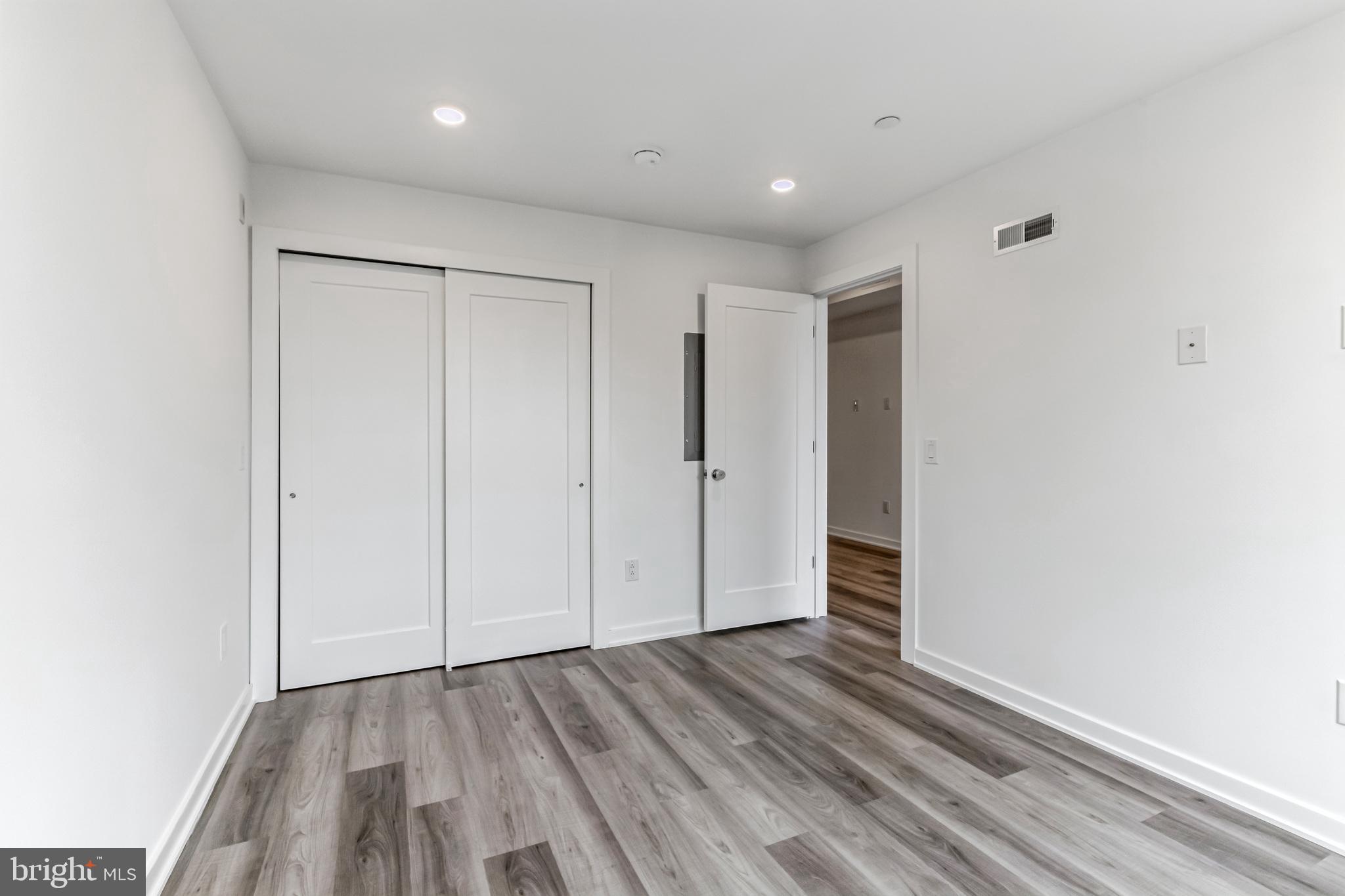 5801 Ridge Avenue, Unit 318 Philadelphia, PA 19128 - Photo 10 of 26 a view of hallway with wooden floor
