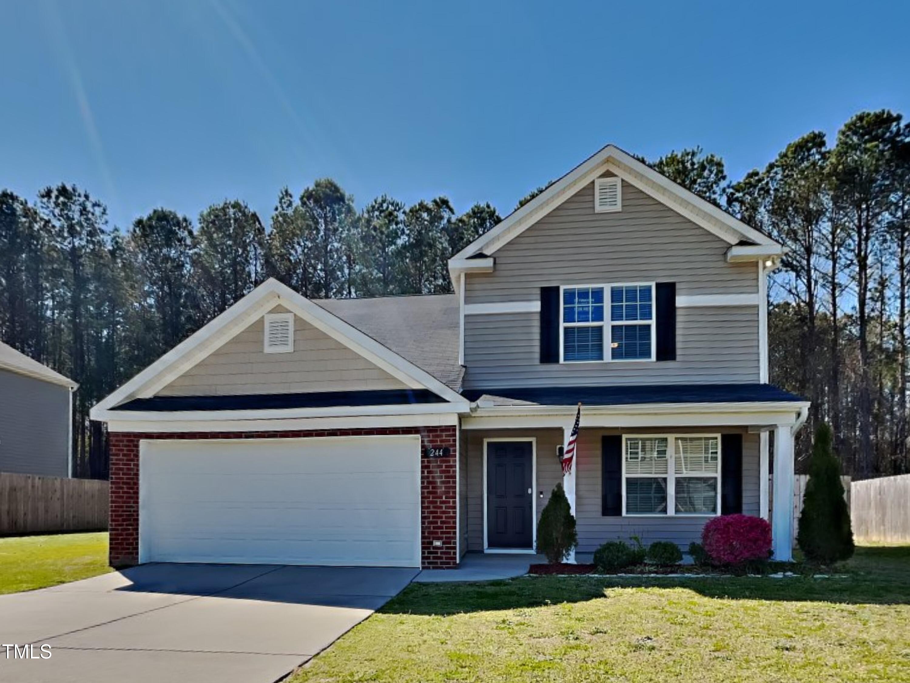 a front view of a house with yard