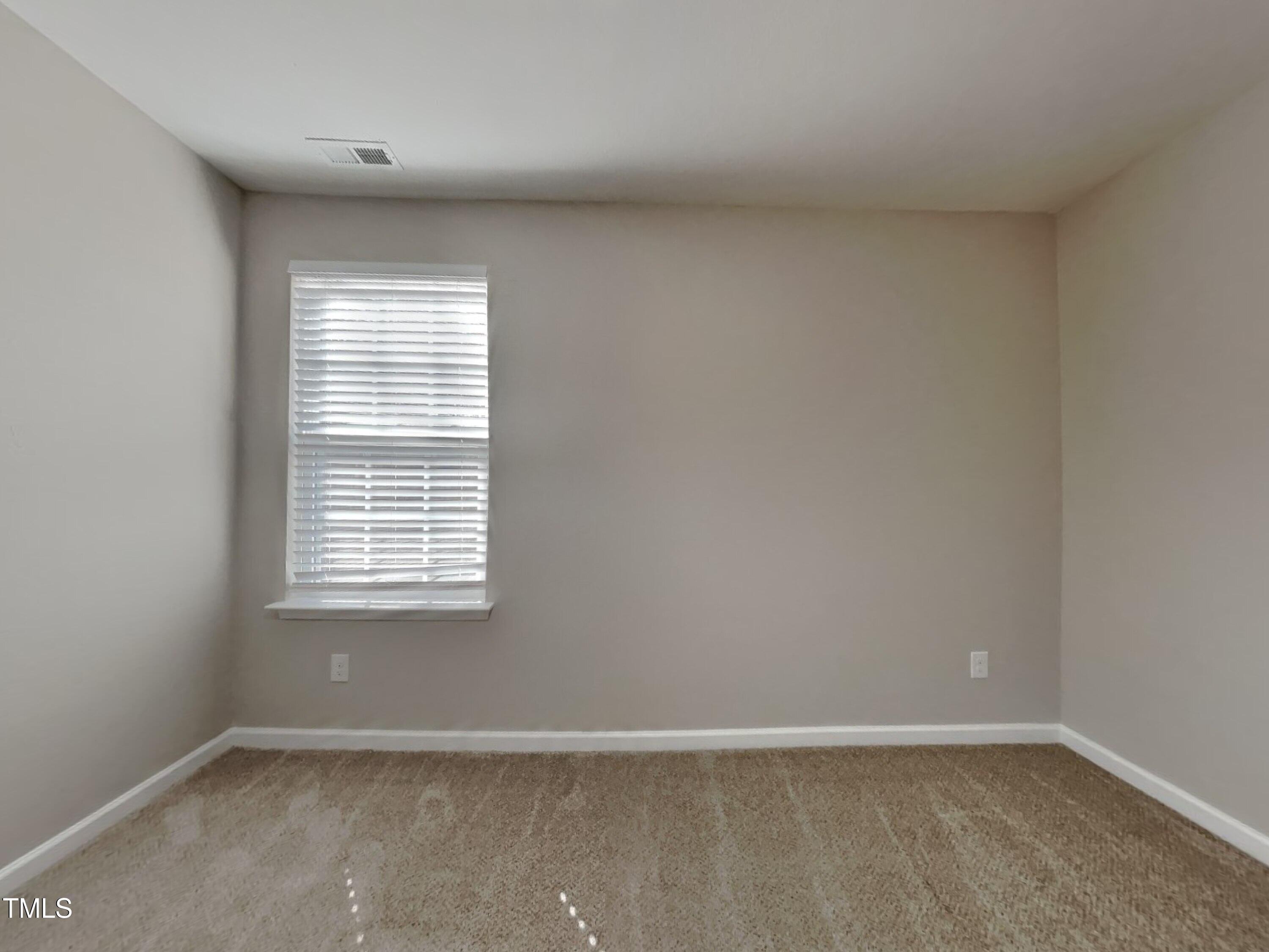 244 Botanical Court Bunnlevel, NC 28323 - Photo 11 of 18 an empty room with a window