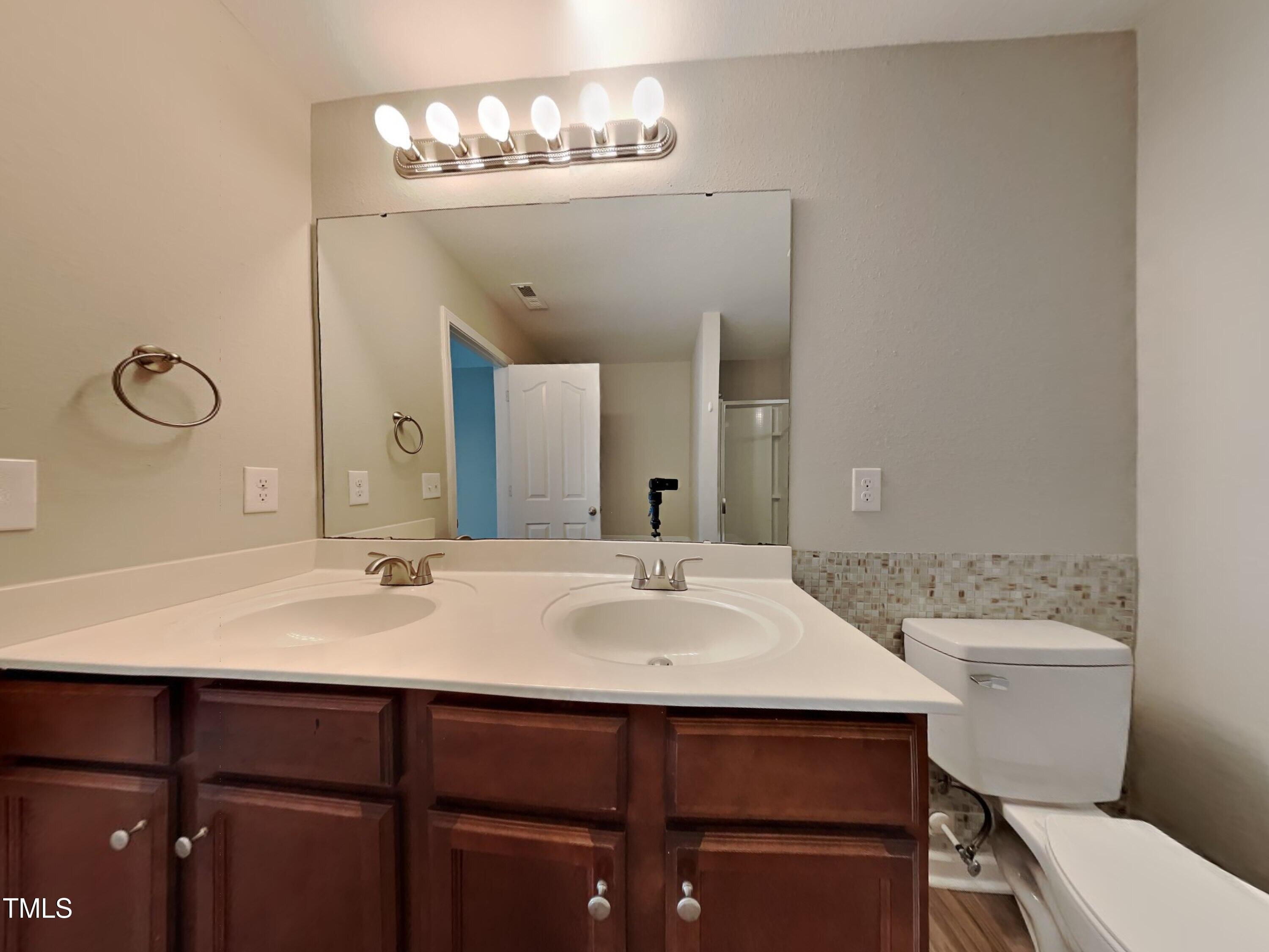 244 Botanical Court Bunnlevel, NC 28323 - Photo 7 of 18 a bathroom with a sink and a toilet