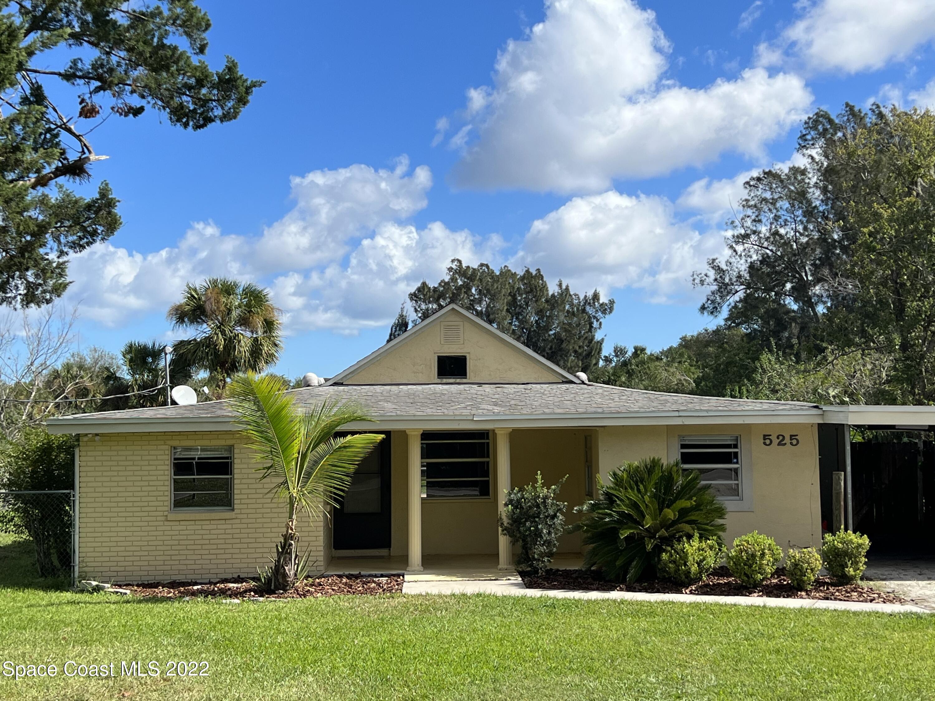 front view of a house with a yard