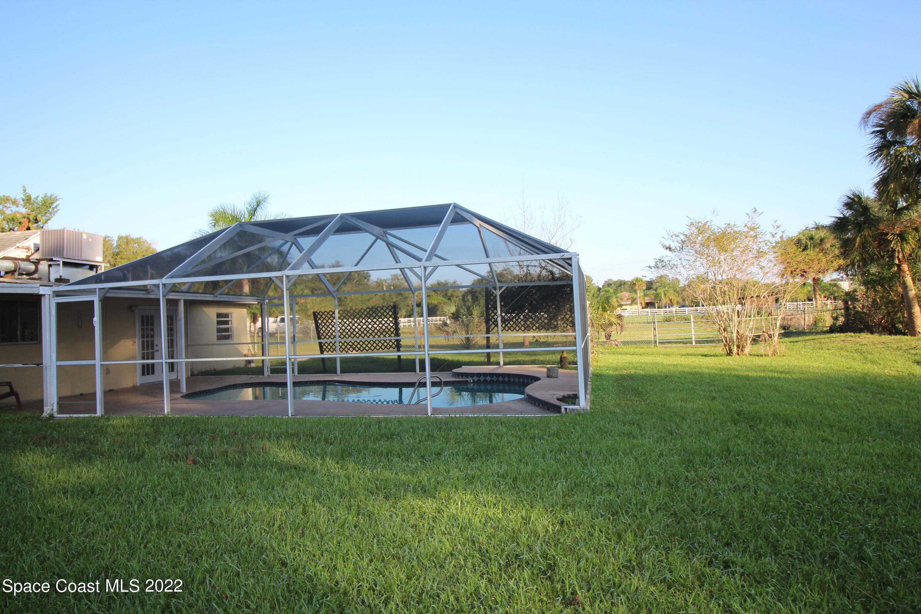 525 North Burnett Road Cocoa, FL 32926 - Photo 12 of 14 a view of a house with a big yard and sitting area