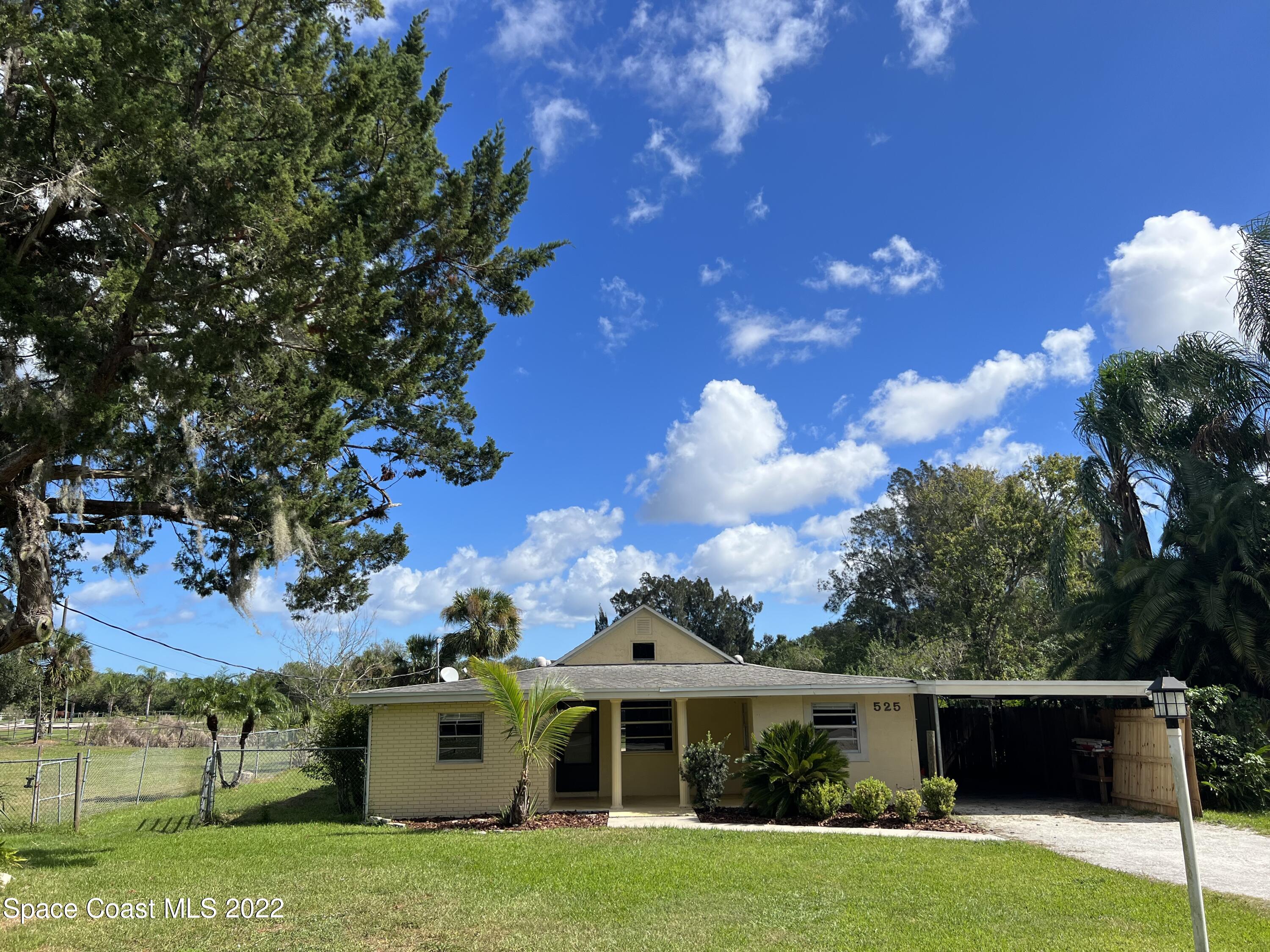 525 North Burnett Road Cocoa, FL 32926 - Photo 14 of 14 a front view of a house with garden
