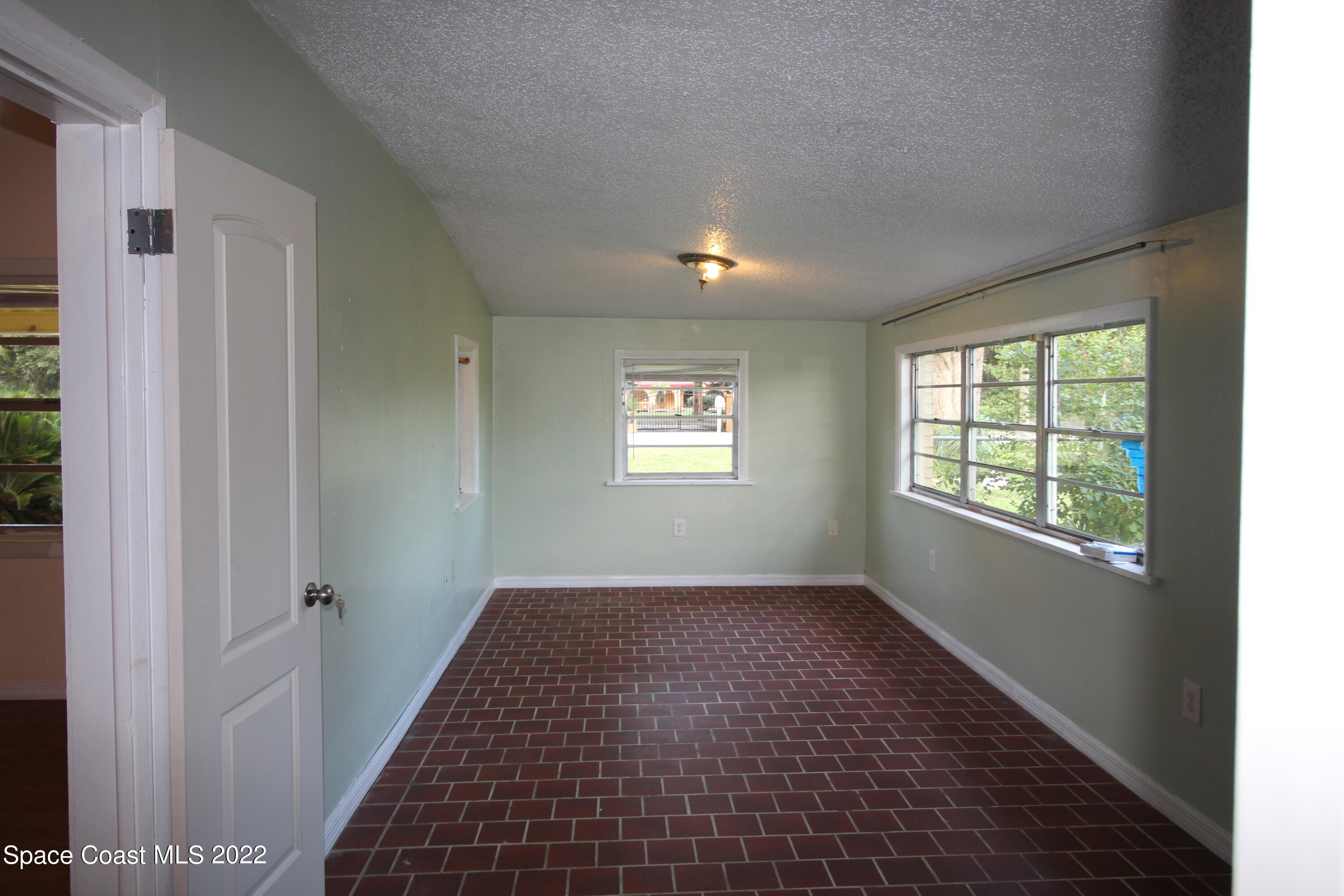 525 North Burnett Road Cocoa, FL 32926 - Photo 6 of 14 a view of an empty room and window
