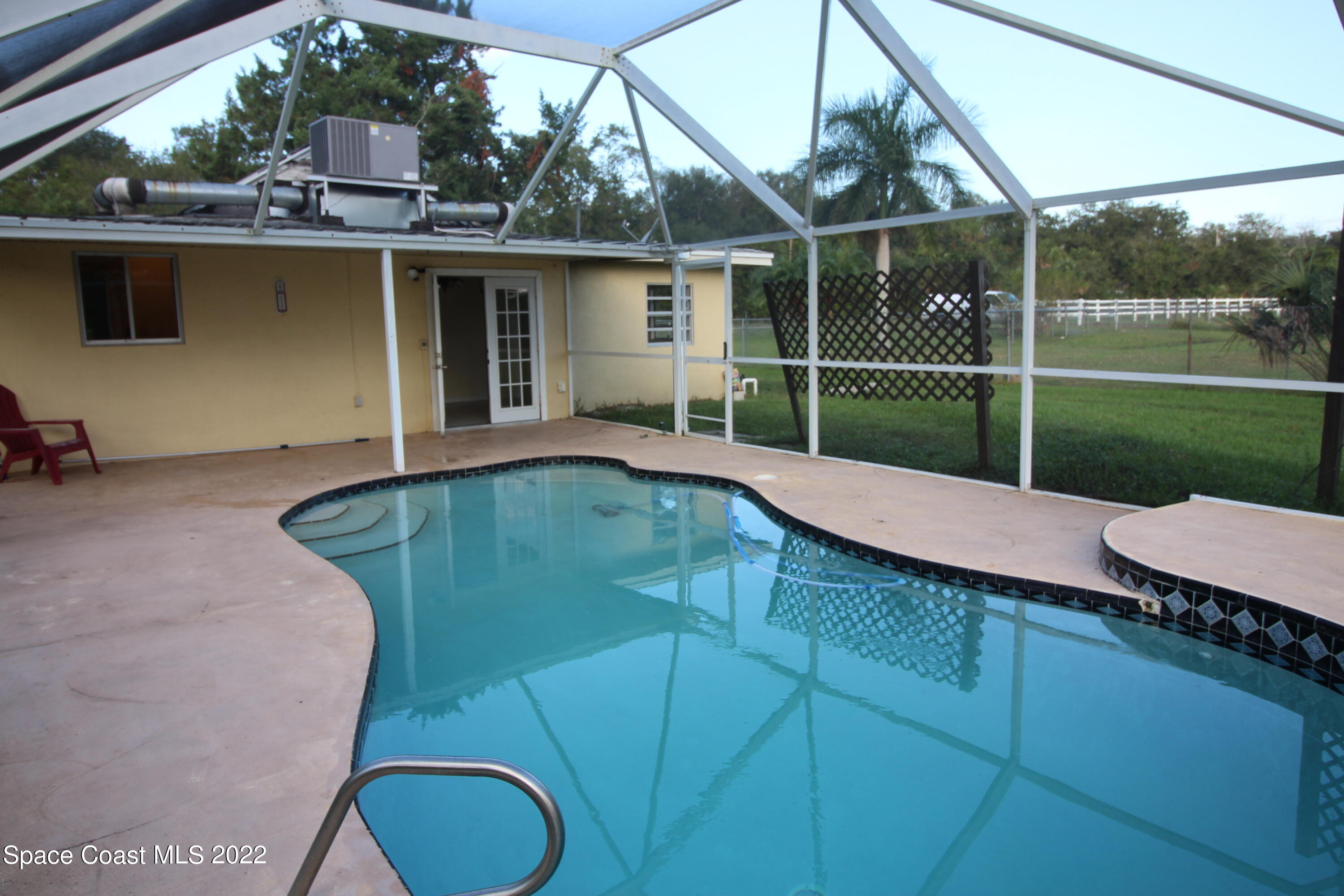525 North Burnett Road Cocoa, FL 32926 - Photo 10 of 14 a view of a house with backyard and sitting area