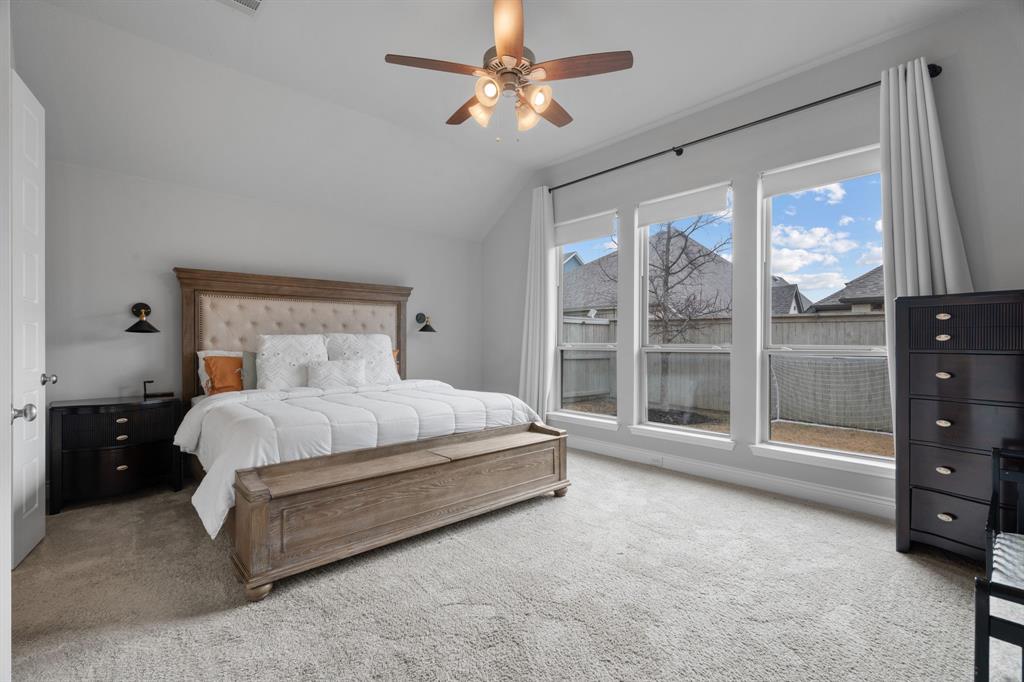 2425 Robin Way Northlake, TX 76247 - Photo 15 of 40 a large white bed sitting in a room next to a window