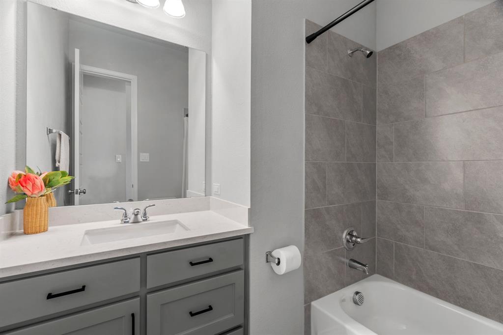 2425 Robin Way Northlake, TX 76247 - Photo 25 of 40 a bathroom with a sink a toilet and shower