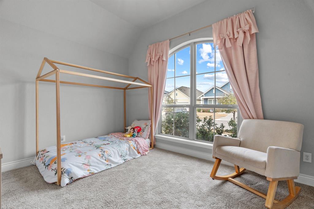 2425 Robin Way Northlake, TX 76247 - Photo 26 of 40 a bedroom with a bed and a couch