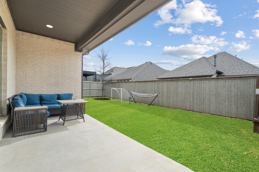 2425 Robin Way Northlake, TX 76247 - Photo 27 of 40 a view of a patio with a table and chairs