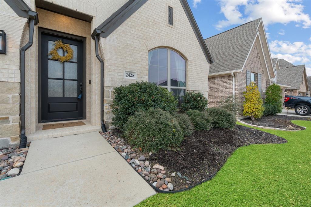 2425 Robin Way Northlake, TX 76247 - Photo 4 of 40 a front view of a house with garden