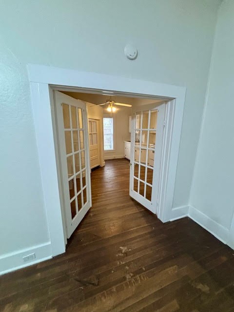 210 East Phillips Street Conroe, TX 77301 - Photo 13 of 27 a view of wooden floor and windows in a room