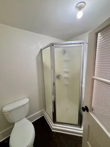 a bathroom with a granite countertop sink toilet and bathtub