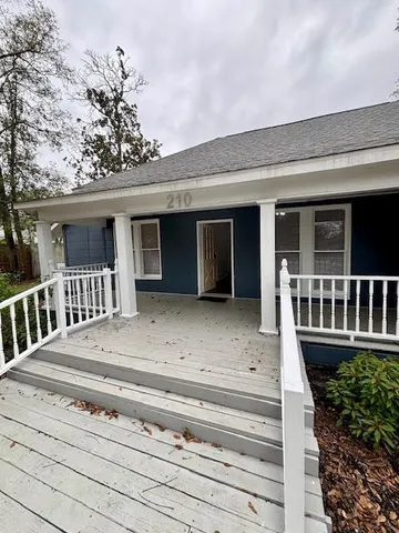 a front view of a house with a porch